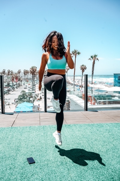 trainer leading class in workout at fit athletic club