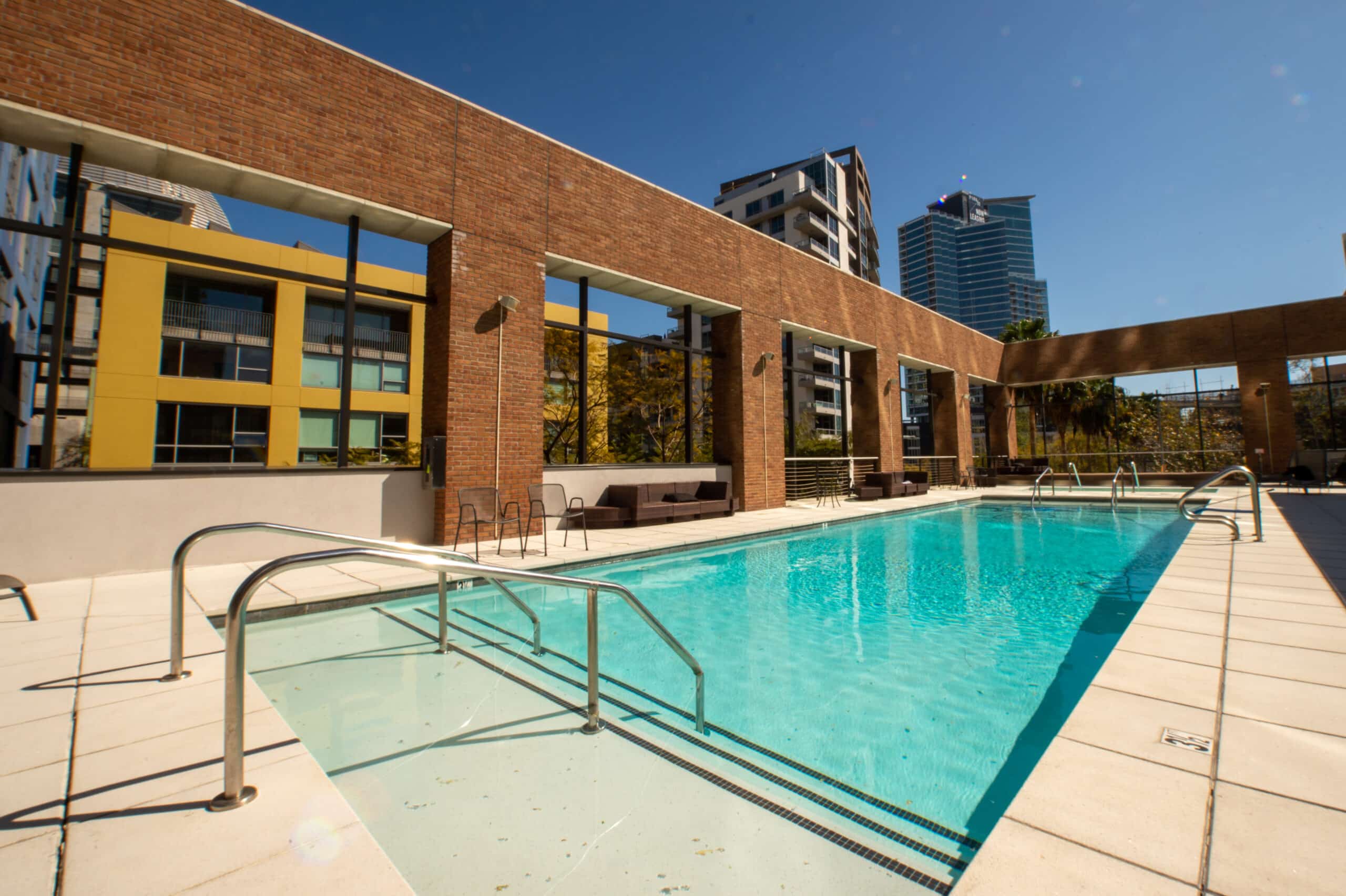 A swimming pool in front of a building.